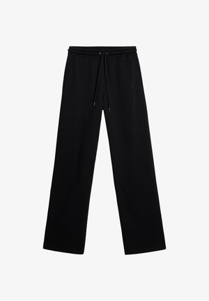 Black sweatpants made from soft fabric, featuring a drawstring waist, wide leg design, and no visible patterns or accents.