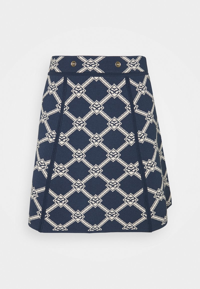 Kurzer Rock aus navy Stoff mit einem weißen geometrischen Muster. Verfügt über zwei goldene Knöpfe am Bund und an den Seitennähten für Struktur.