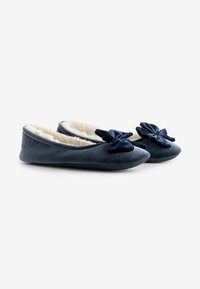 Navy blue velvet slippers with a soft cream fur lining. Features a decorative bow on each shoe's toe. Flat, flexible sole.