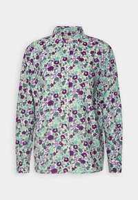 Chemise à manches longues boutonnée avec un motif floral vert, violet et lavande sur fond blanc.