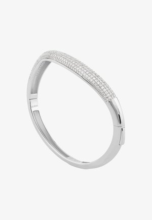 Bracelet jonc en argent avec un design lisse et arrondi, orné d'une rangée de cristaux clairs sur le dessus pour un éclat et une texture supplémentaires.