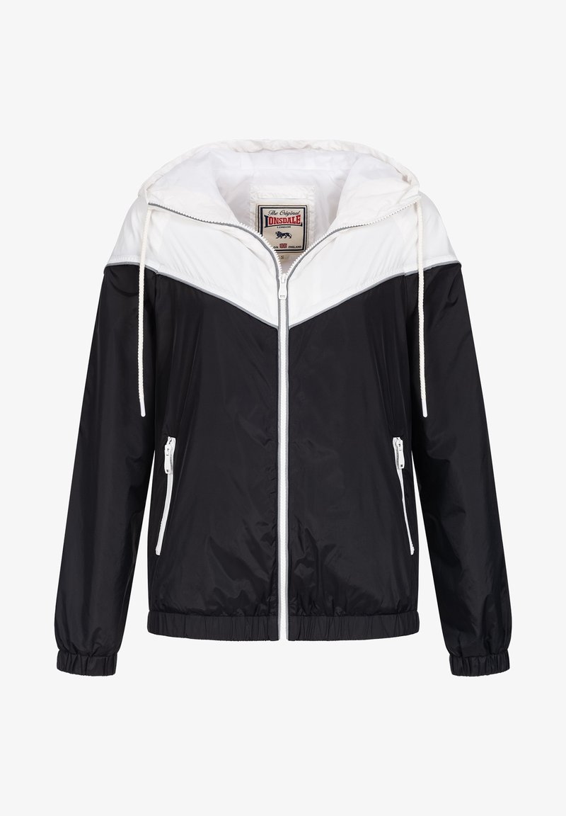 Giacca a vento con cappuccio in bianco e nero, con chiusura a zip, polsini elasticizzati e tasche laterali con zip. Presenta un design distintivo a blocchi di colore.