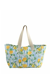 Tote bag with a lemon and floral design on a blue and white striped background. Features beige flat handles and a soft, flexible fabric.