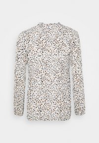 Blusa bianca a maniche lunghe con un motivo sparso di nero, marrone e arancione. Caratterizzata da un collo rotondo e un tessuto testurizzato.
