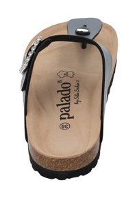 Black slide sandal with a cork sole and a textured beige footbed. Features a decorative silver accent on the strap and adjustable buckle.