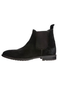 Czarne zamszowe botki za kostkę z elastycznymi bocznymi panelami, zaokrąglonym noskiem i przeszyciami na krawędziach. Solidna gumowa podeszwa zapewniająca przyczepność.