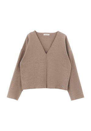 Maglione corto beige con scollatura a V profonda, maniche lunghe e tessuto morbido. Presenta una piccola etichetta sull'orlo con il marchio "OXXO".
