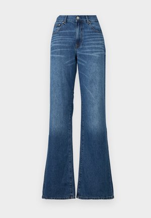 Breda jeans gjorda av medelblå denim. Har hög midja, frontknäppning och minimalt blekning. Rak snitt från lår till nederkant.