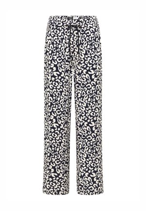 Pantalon ample avec imprimé léopard noir et blanc, taille élastique et cordon noir à l'avant.