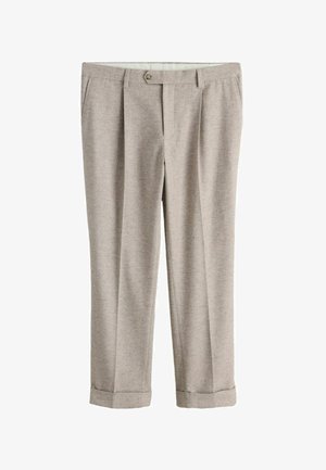 Világos bézs, testre szabott nadrág gombos záródással, övbújtatókkal, oldalzsebekkel és felhajtott szegélyekkel.