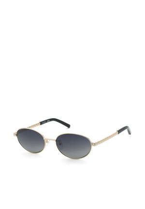 Lunettes de soleil ovales avec monture en métal doré et branches dorées texturées, avec des verres dégradés foncés et des embouts d'oreille noirs.