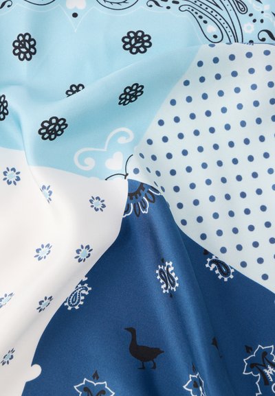 Mitmevärviline kangas tänapäevase tikandiga, millel on sinised ja valged alad lillemotiivide, täppide ja musta hane mustriga. Pehme tekstuur.