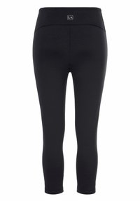 Schwarze Leggings mit hohem Bund, aus dehnbarem Stoff. Verfügt über ein kleines Logo auf der Rückseite und ein eng anliegendes Design.