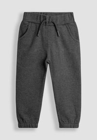 Pantalones de chándal gris oscuro hechos de una tela suave, con cintura elástica y cordón. Presentan bolsillos laterales y puños elásticos en los tobillos.