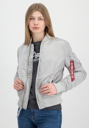 Grey bomber jacket with a smooth finish, ribbed cuffs and collar, front zip, and a patch with a red ribbon detail on the sleeve.