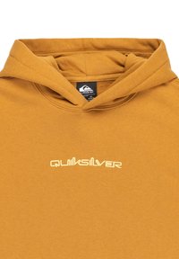Felpa gialla senape realizzata in tessuto morbido, con tasca a marsupio e logo Quiksilver bianco, dotata di cappuccio con cordini.