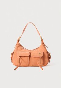 Peach suede handbag with a curved silhouette, two front zip pockets, gold-tone hardware, and a single shoulder strap.