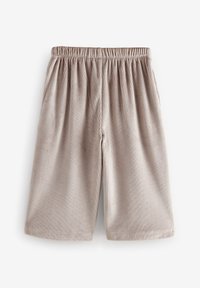 Hellbeige, gerippte Shorts mit einem elastischen Bund, gerader Schnitt und weichem Material. Keine sichtbaren Taschen oder Verzierungen.