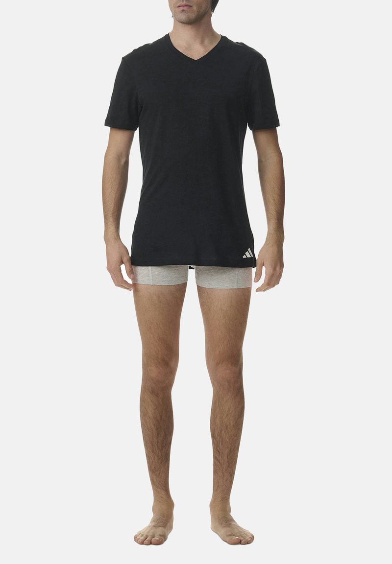 Black cotton V-neck t-shirt paired with light gray boxer briefs, featuring a simple design, short sleeves, and a relaxed fit.