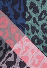 Four fabric sections featuring leopard print in various colors: navy, green, pink, and gray with distinct patterns and textures.
