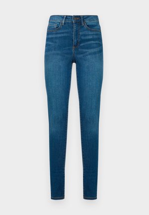 Skinny jeans in donkerblauwe denim, met een hoge taille, gestikte details en een traditionele vijf-pocket ontwerp. Soepele textuur, zonder patronen.