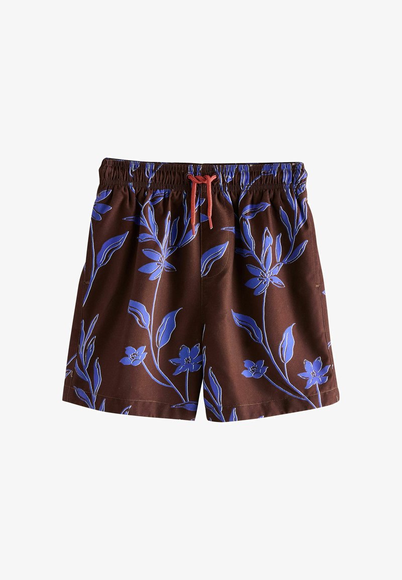 Short marron à taille élastique avec imprimé floral bleu et cordon rouge sur fond blanc.
