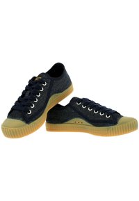 Blue denim sneakers with round toe, dark laces, and rubber sole. Features textured fabric and light brown gum outsole.