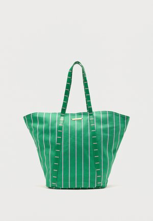 Green tote bag with vertical white stripes and long handles, standing upright on a white background.