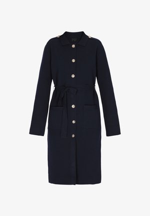 Marineblaues, knöpfbares Kleid mit langen Ärmeln, Taillengürtel und zwei vorderen Taschen. Mit goldfarbenen Knöpfen und Kragen. Weicher, strukturierter Stoff.