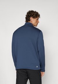 Giacca zip-up blu navy con colletto a bavero, realizzata in tessuto liscio, con etichetta logo sul retro in basso e maniche lunghe.