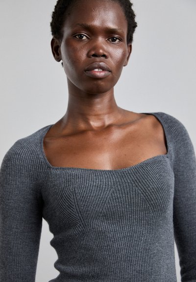Gray ribbed knit sweater with a square neckline and long sleeves, featuring subtle texture and seam detailing on the front.