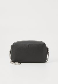 Black leather bag with a textured finish, rectangular shape, zip closure, and a silver chain strap on one side. Simple embossed detailing.