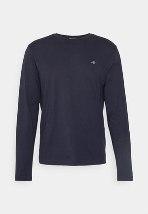 Marinefarbener Langarm-T-Shirt aus weichem Material, mit Rundhalsausschnitt, schmaler Passform und kleinem gesticktem Logo auf der Brust.