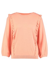 Pulovr broskvové barvy s volánkovými ozdobami podél švů, kulatým výstřihem a balónovými rukávy. Měkká, texturovaná látka.