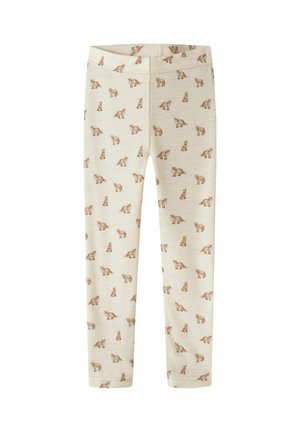 Beige børneleggings med et småt brun rævemønster over det hele.
