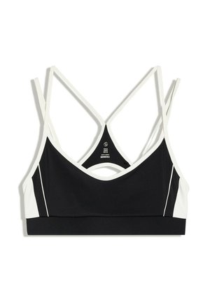 Brassière de sport noire avec bordure blanche et fines bretelles blanches croisées sur fond blanc.