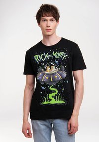 Black cotton t-shirt featuring a colorful "Rick and Morty" graphic, depicting characters in a spaceship with green slime accents and space elements.