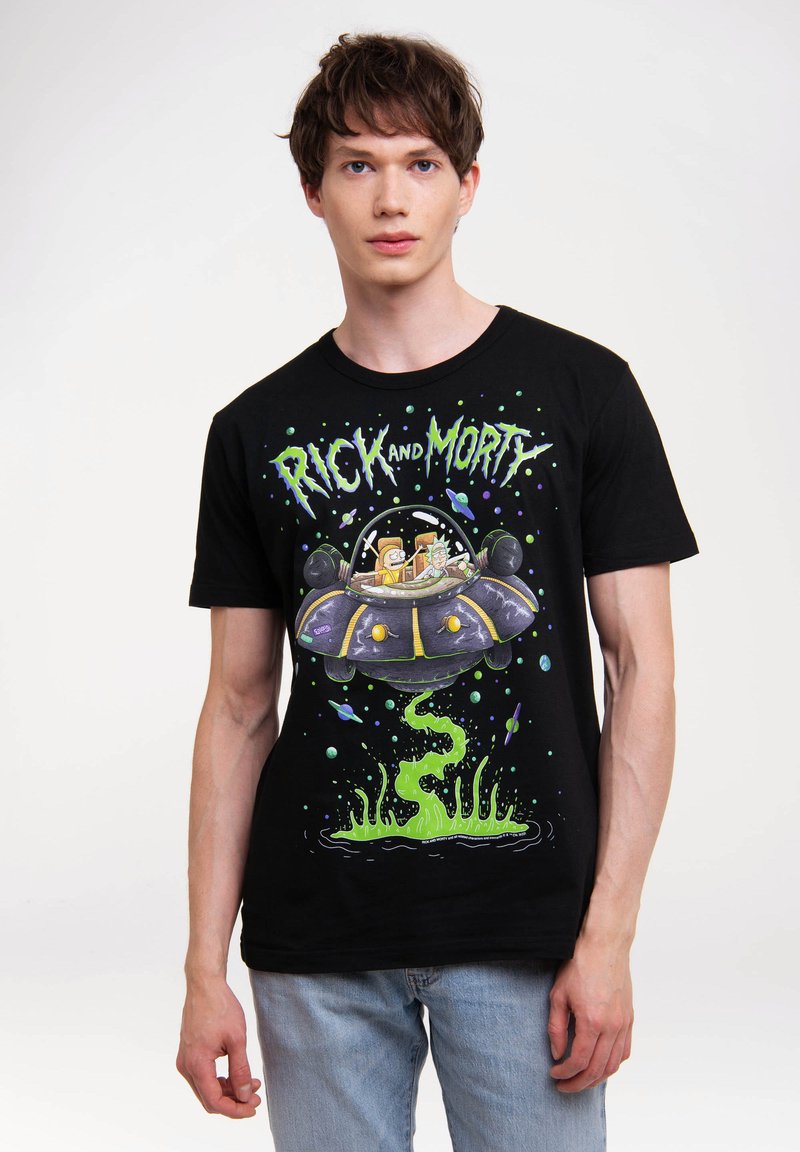 Black cotton t-shirt featuring a colorful "Rick and Morty" graphic, depicting characters in a spaceship with green slime accents and space elements.