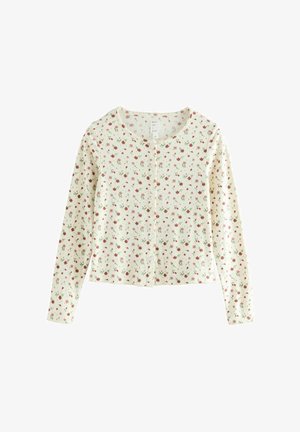 Lange mouwen cardigan van lichtgewicht stof, crème met een bloemig patroon in rood en groen, met een knoopsluiting aan de voorkant en een geribde textuur.