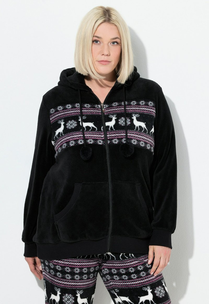 Sort fleece zip-up hættejakke med et mønstret bånd om livet, der prydes af hvide rensdyr og snemænd. Indeholder forlommer og hætte med snore.