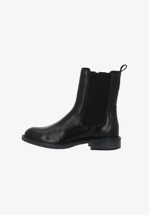Bottine noire en cuir avec panneaux latéraux élastiques, bout arrondi et semelle en caoutchouc texturé. Dispose d'une languette à l'arrière pour un enfilage facile.