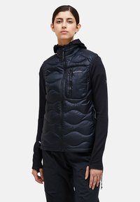 Navy insulated vest with a zippered pocket, quilted design, and a high collar. Fabric appears smooth and shiny with a fitted shape.