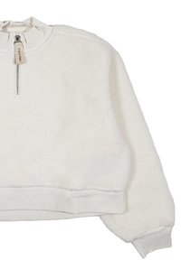 Maglione di pile bianco con colletto a mezza zip, polsini e orlo a costine. Tessuto morbido e testurizzato con un design corto. Etichetta visibile sul colletto.