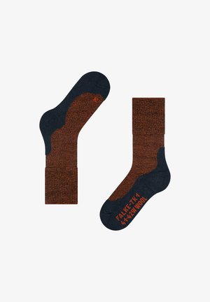 Swetry skarpet w ciemnym granacie z pomarańczowym wzorem w kropki, wyposażone w wzmocnione obszary na pięcie i palcach; oznaczone rozmiarem i szczegółami materiału.