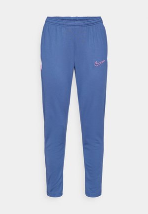 Navy blue athletic pants with an elastic waistband, tapered legs, and a pink Nike logo on the left thigh. Smooth, stretchy fabric.