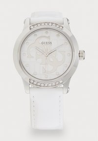 Orologio di tonalità argento con cinturino in pelle bianca. Il quadrante presenta uno sfondo testurizzato con logo e punti. Accentuato da cristalli trasparenti.