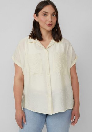 Korte mouwen, knoopsluiting overhemd in lichtgeel, met twee voorzakken en een gestructureerde stof. Comfortabele pasvorm met een kraag.