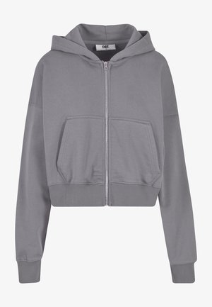 Grijze cropped hoodie met een rits, voorzakken, lange mouwen en geribde manchetten. Gemaakt van zachte stof met een gladde textuur.