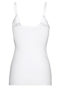 White camisole made of smooth fabric, featuring scalloped edges, adjustable straps, and a fitted design. No patterns or accents.