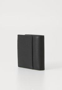 Black leather wallet with a textured surface. Compact rectangular shape with a fold-over design. Features minimal stitching and no visible hardware.